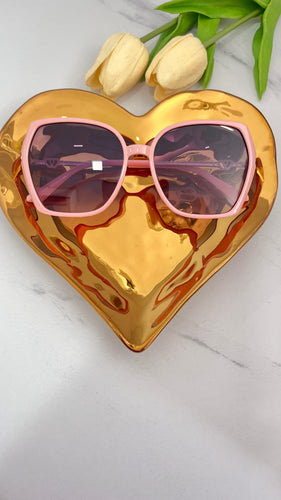 Baby Pink MT Sunnies displayed on a golden heart-shaped tray, perfect quality jewelry accessory for stylish looks.