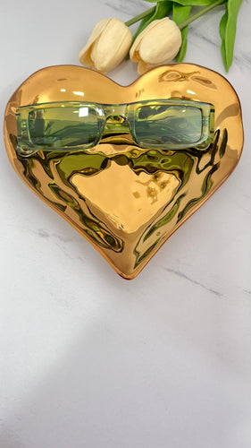 Bossy MT Sunnies displayed on a gold heart-shaped tray with tulips, showcasing quality jewelry style sunglasses.
